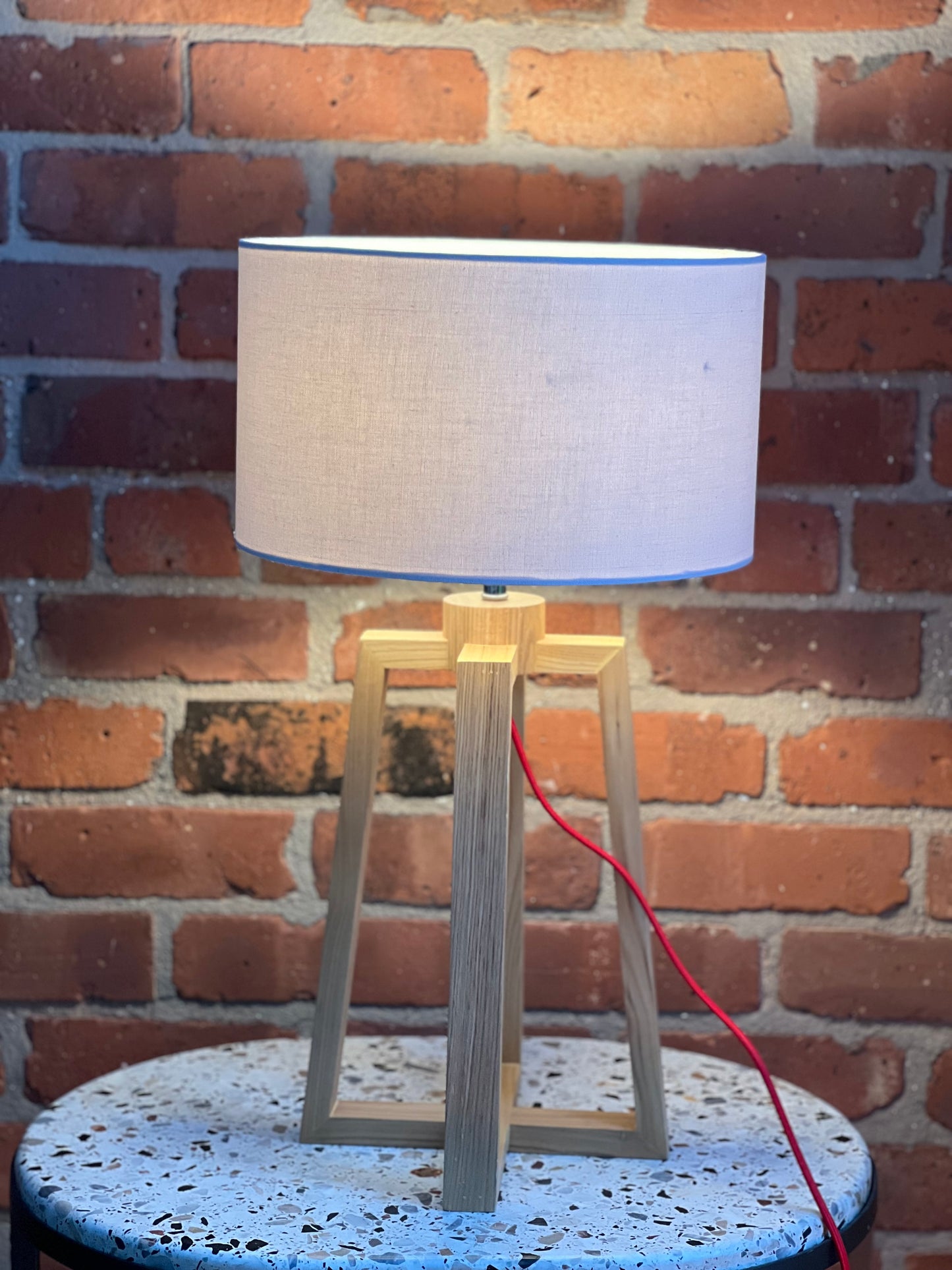Wooden pyramid table lamp with linen shade