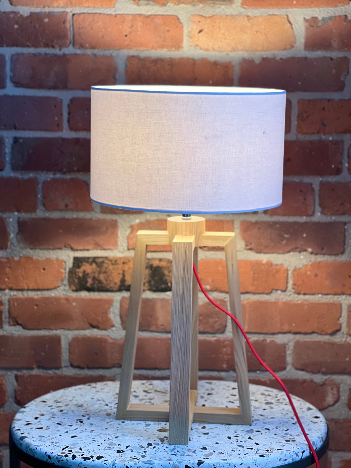 Wooden pyramid table lamp with linen shade