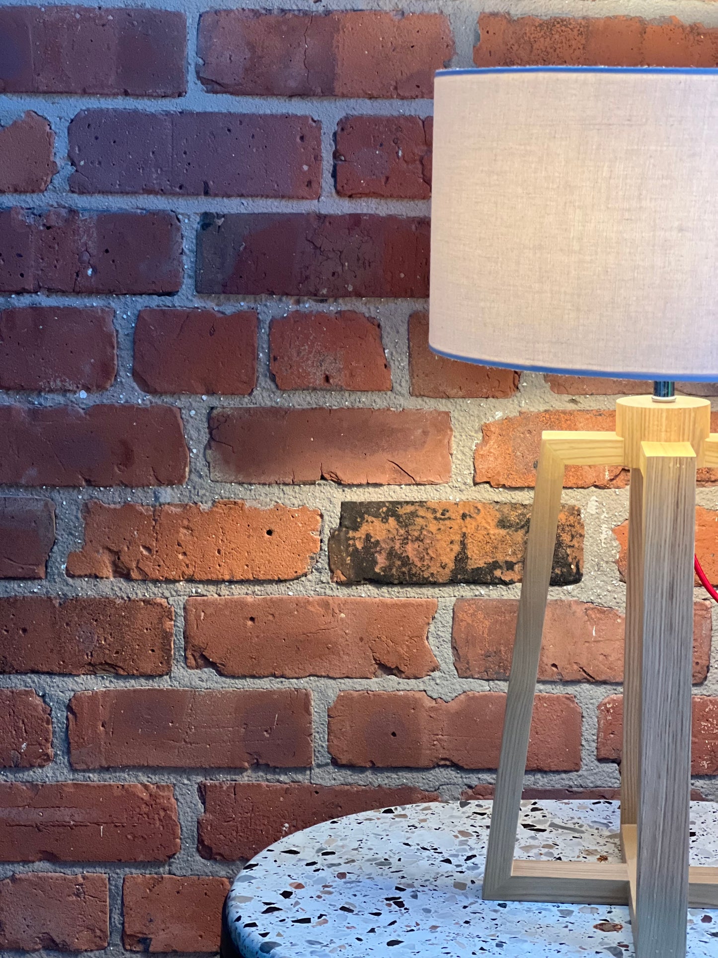Wooden pyramid table lamp with linen shade