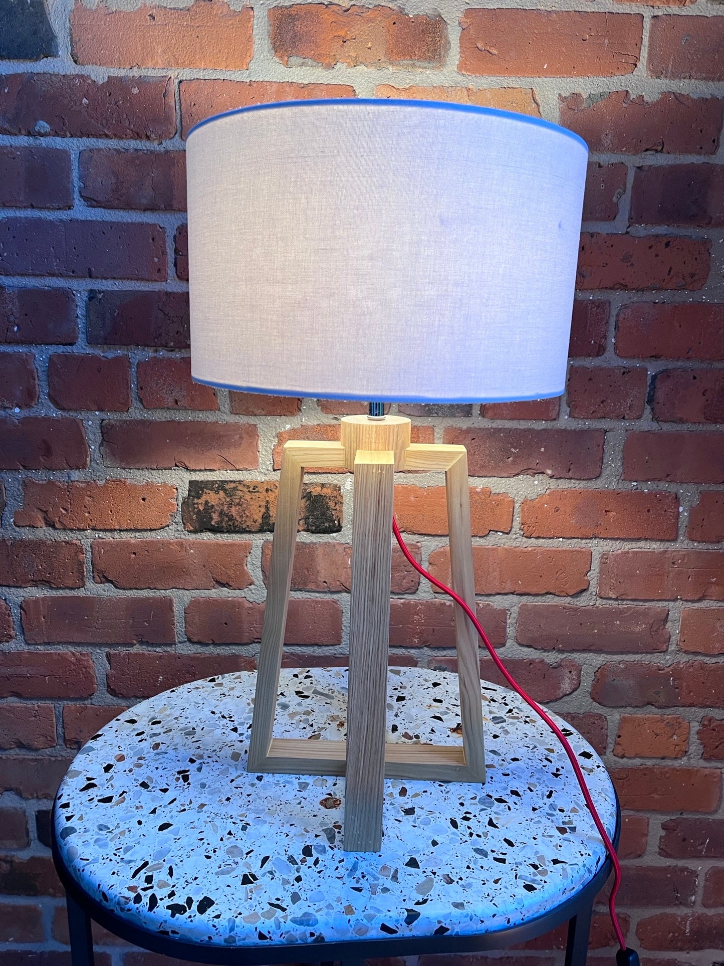 Wooden pyramid table lamp with linen shade