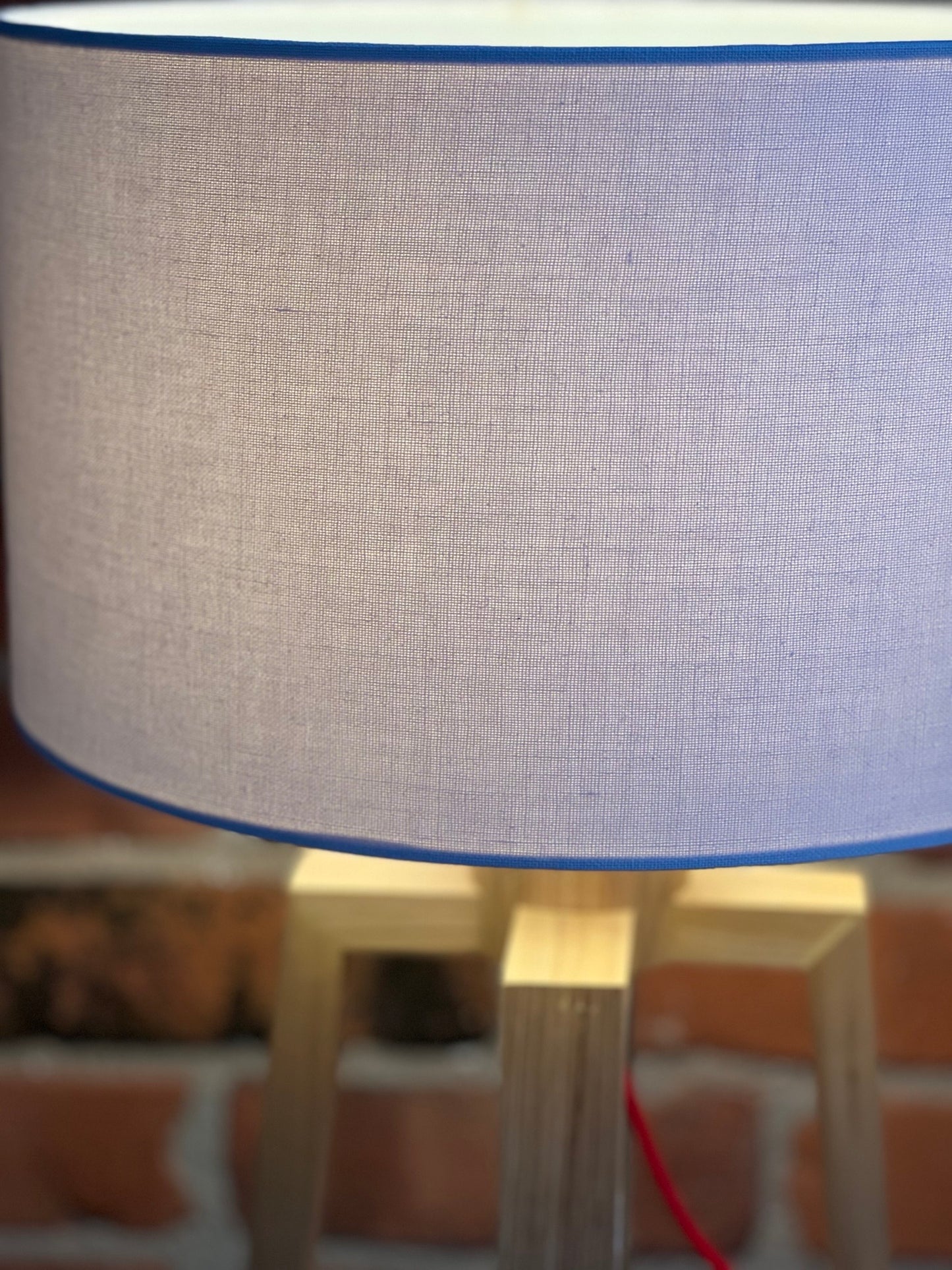 Wooden pyramid table lamp with linen shade