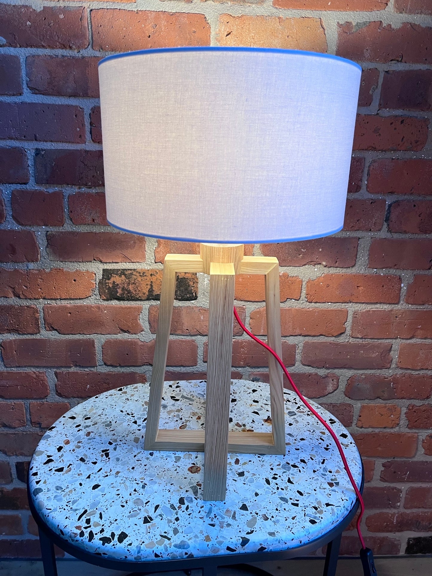 Wooden pyramid table lamp with linen shade
