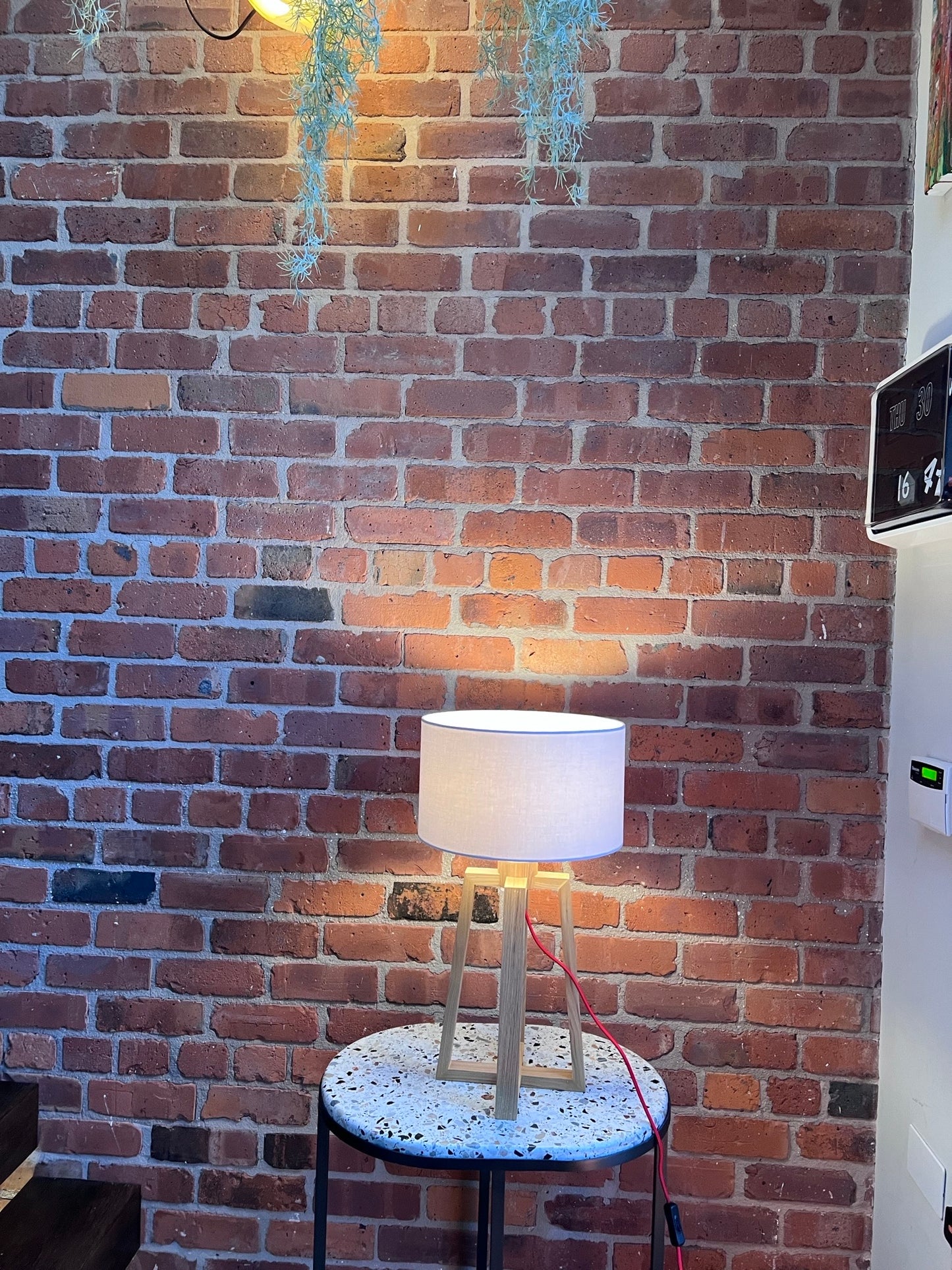 Wooden pyramid table lamp with linen shade