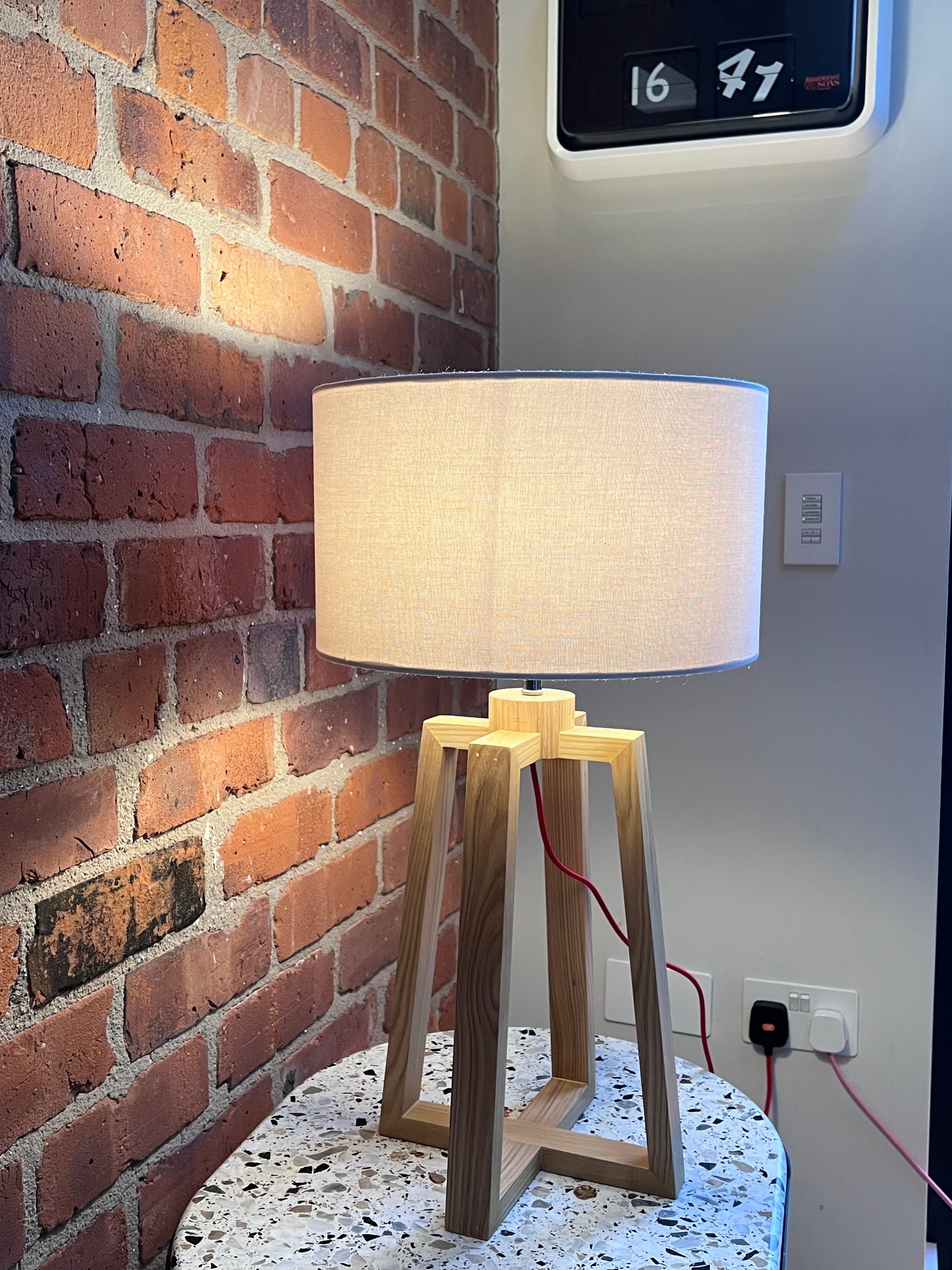 Wooden pyramid table lamp with linen shade